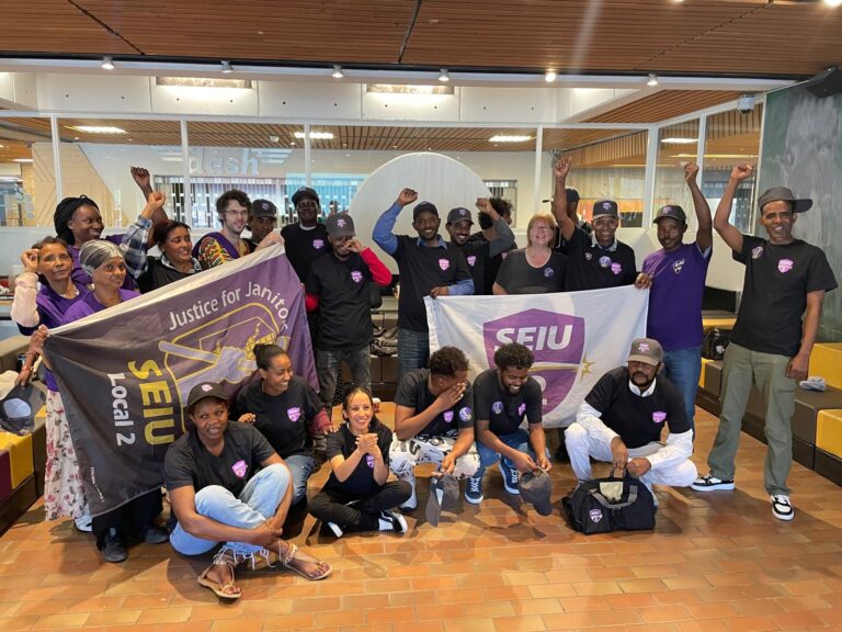 Dexterra janitors at the University of Winnipeg take a group photo after a unanimous strike vote.